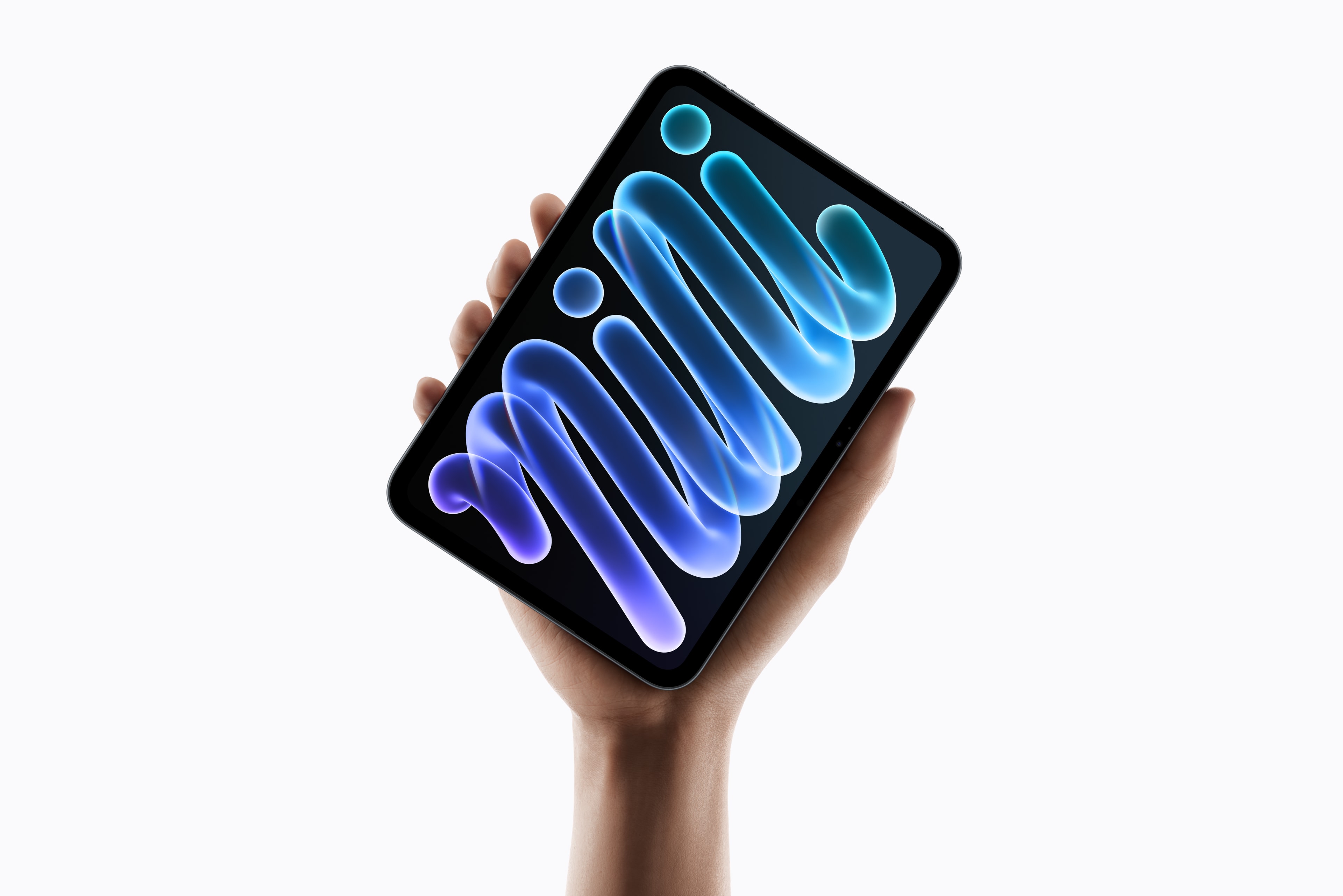 Apple’s new iPad mini held upright in one hand, with a blue and purple mini graphic on its display.