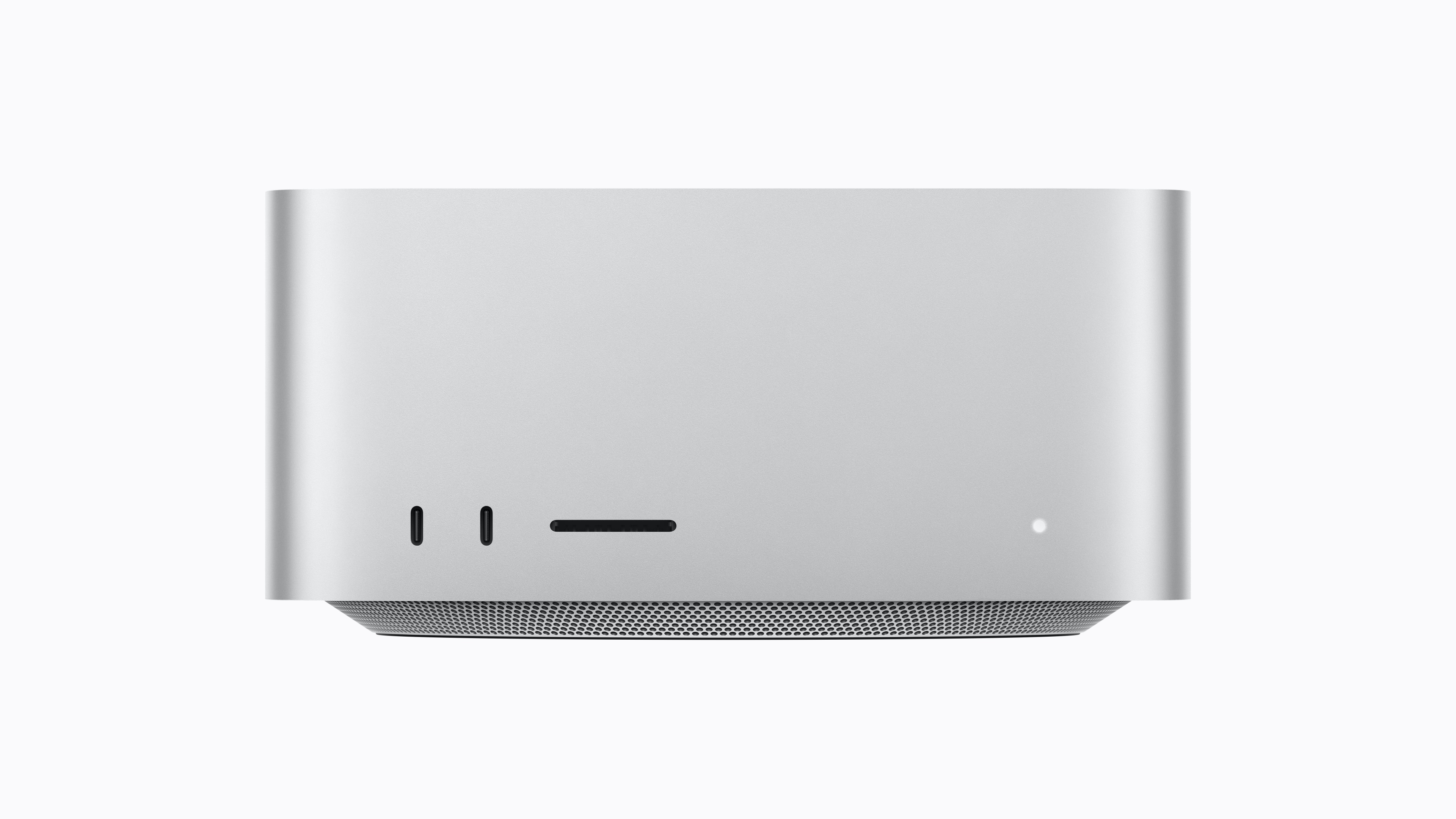 Front view of Apple’s silver Mac Studio desktop, showing two USB-C ports and an SD card slot.