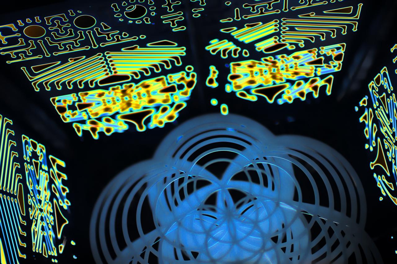 A dense wall of exposed circuit boards and wiring inside a machine, with traces and connectors filling the frame.