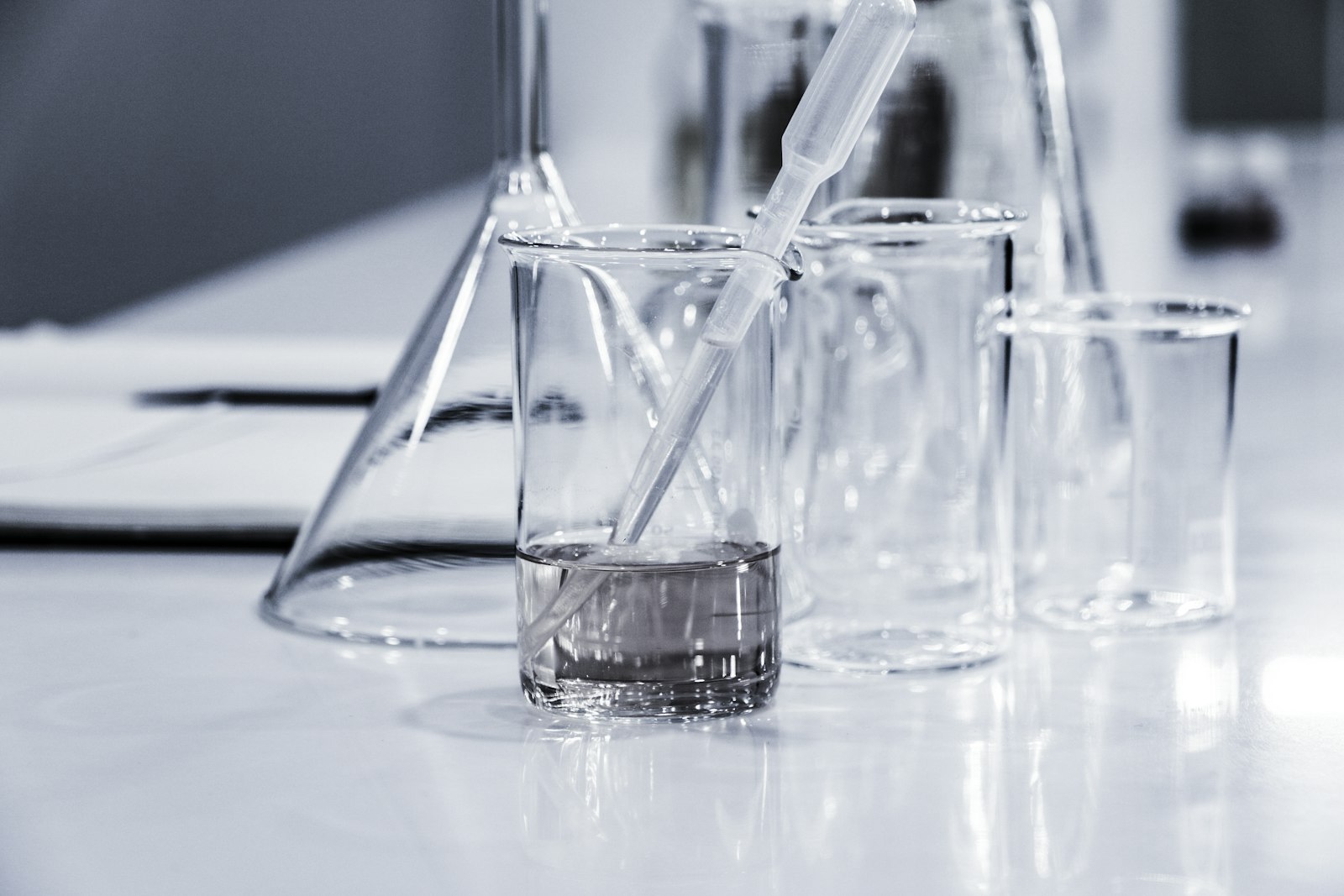 Scientists working with glassware in a chemistry laboratory