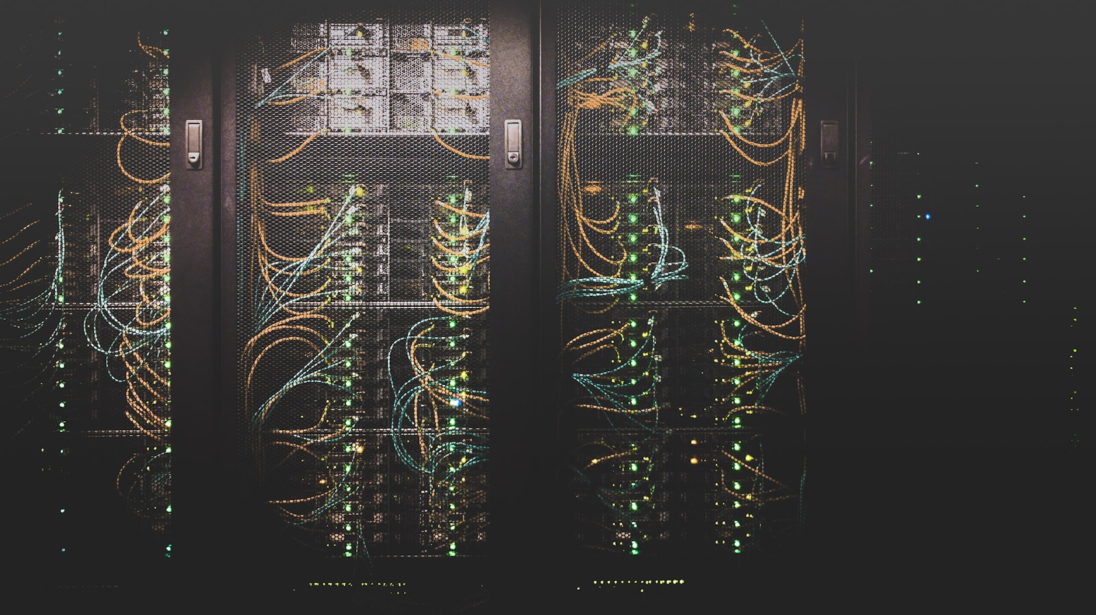 Rows of servers and networking gear in a data center aisle
