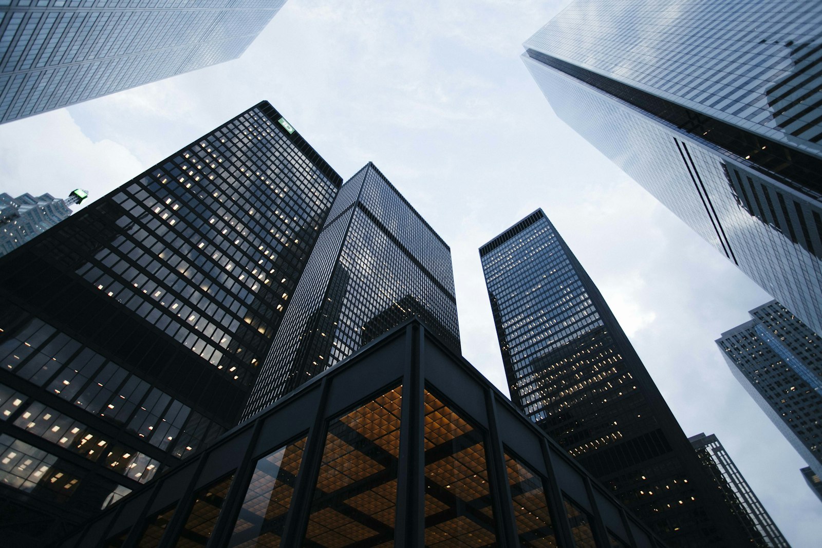 Glass skyscrapers rising against a clear sky in a financial district