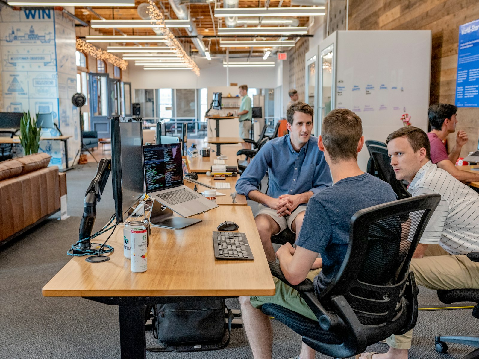 People collaborating on a project at a bright office desk