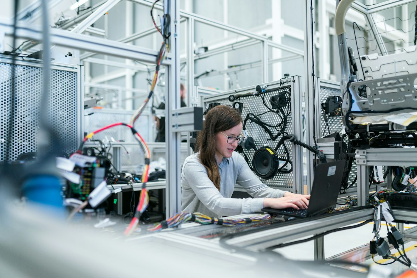 Engineer working at a laptop in a tech lab