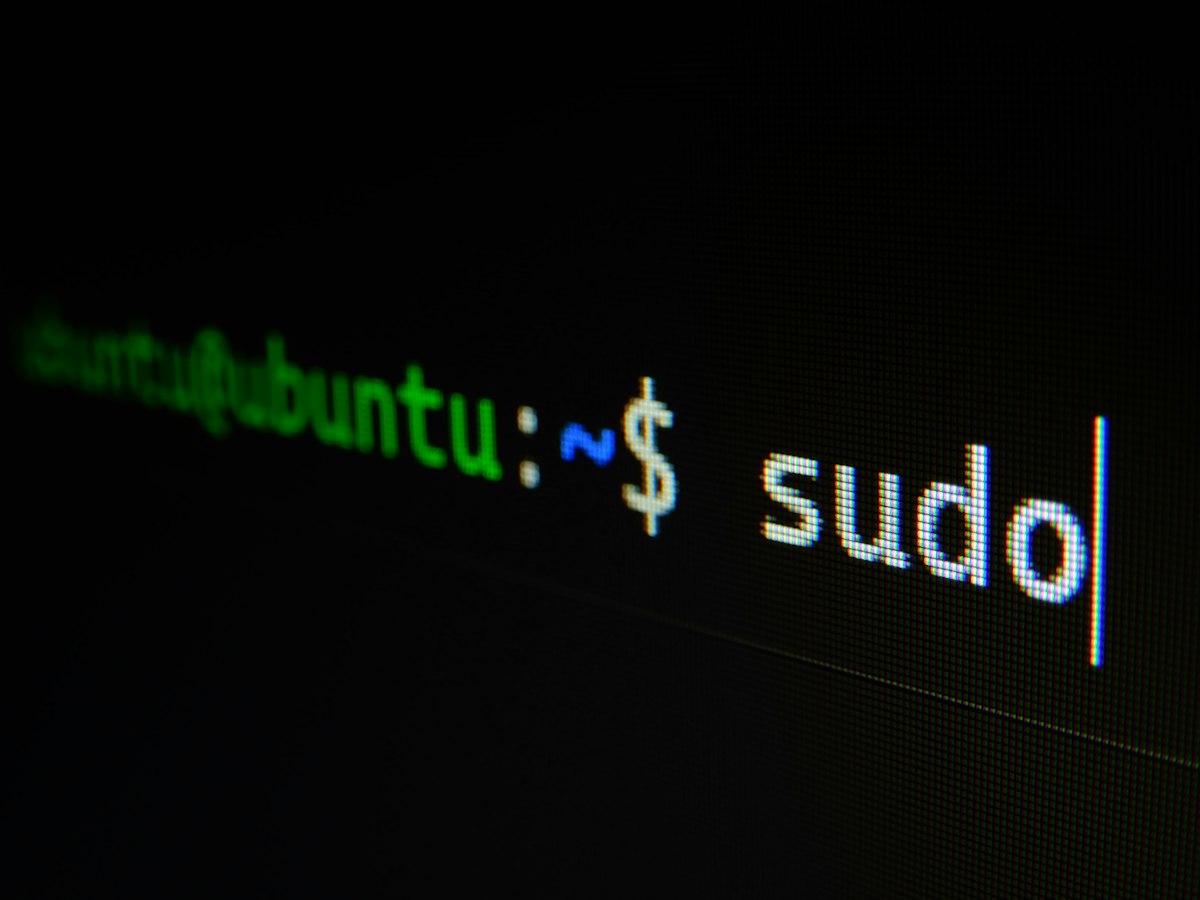 Laptop screen showing a code editor and terminal