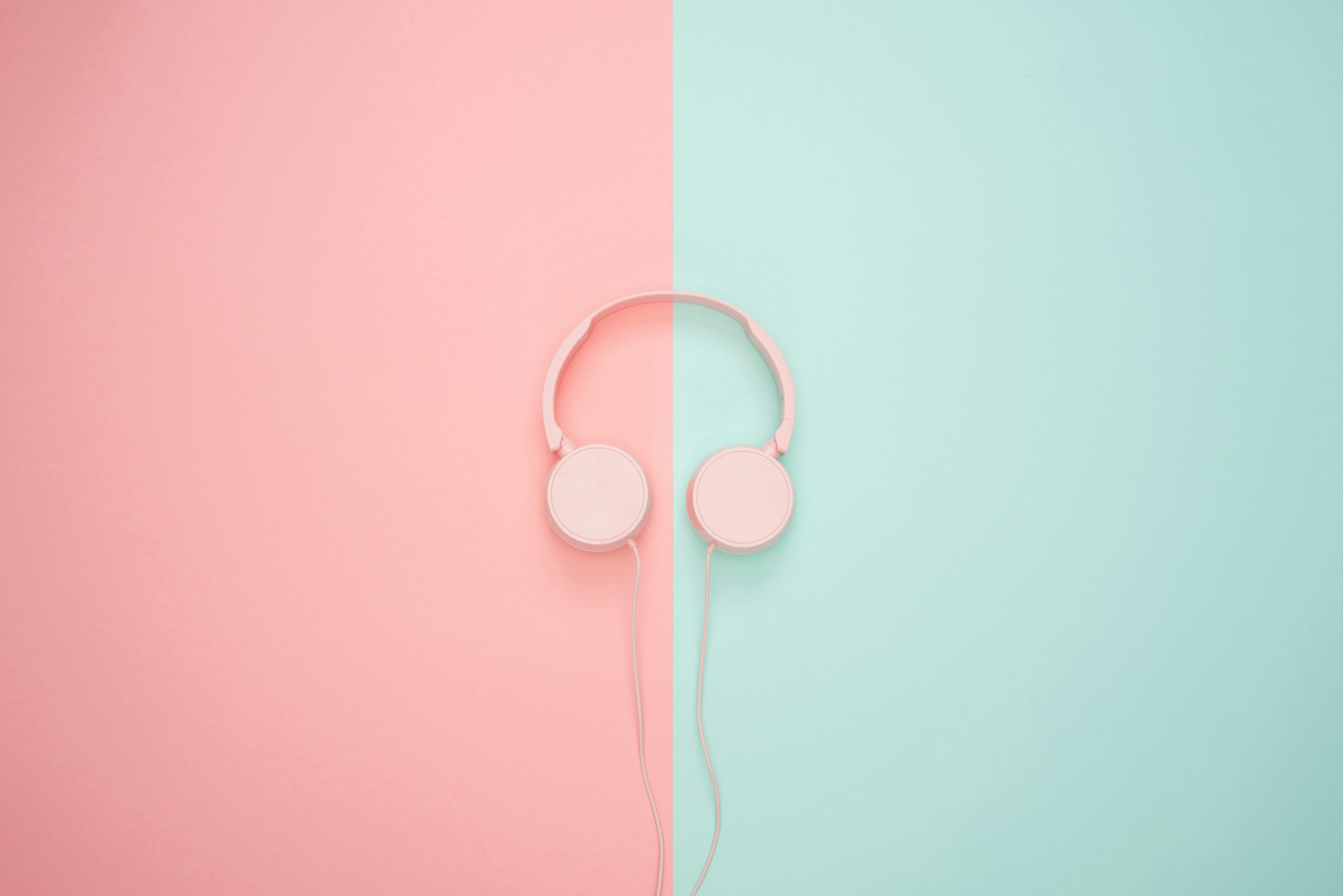 Yellow over-ear headphones resting on a colorful surface