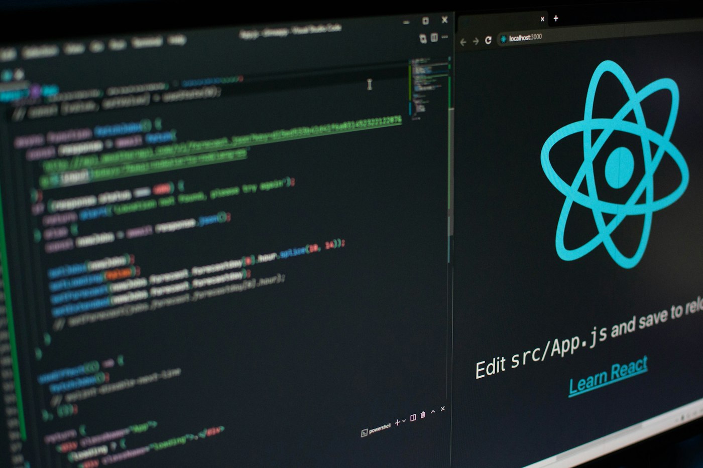 Dual monitors with a code editor and a local React app in a dark workspace