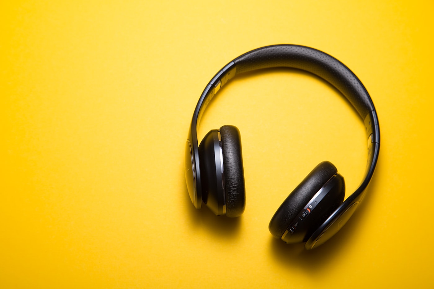 Black over-ear headphones on a desk