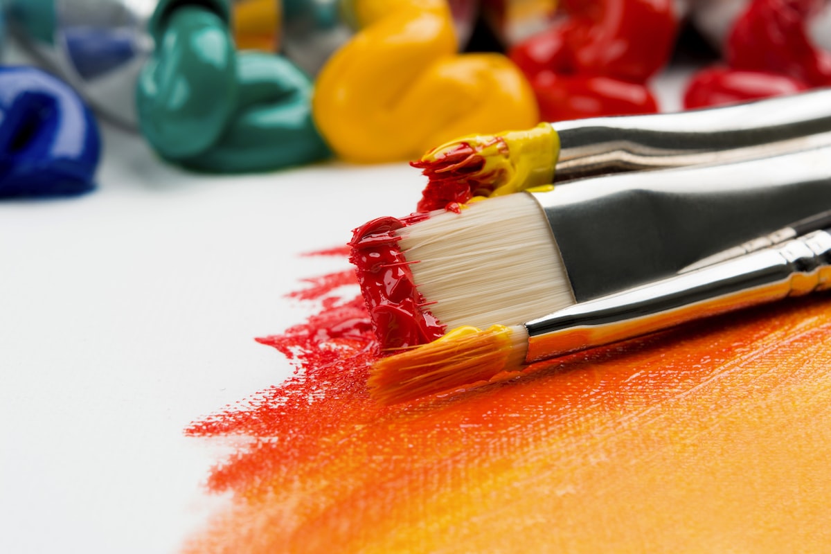 Artist paint brushes and colorful palette
