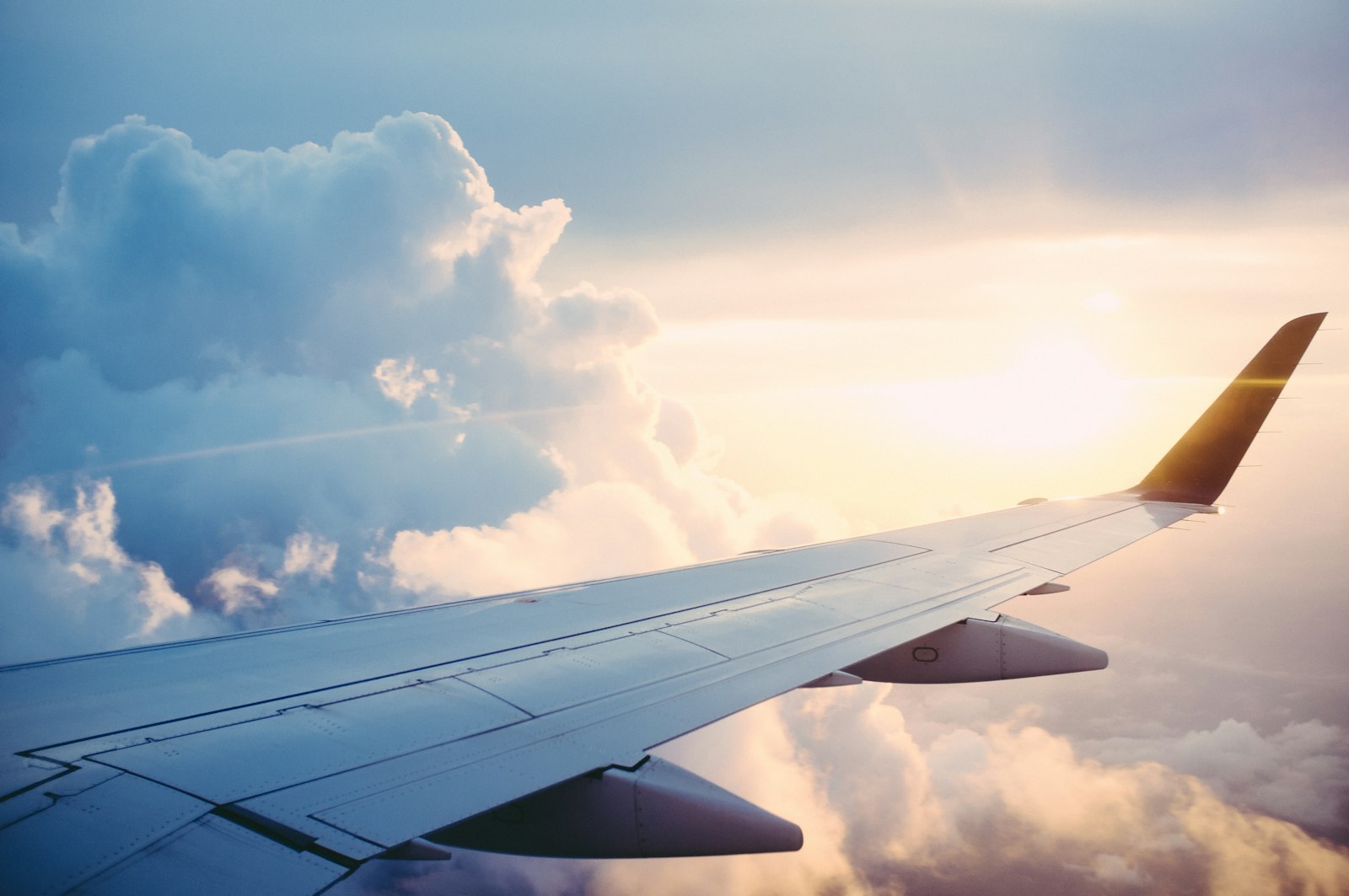Airplane wing above the clouds during flight