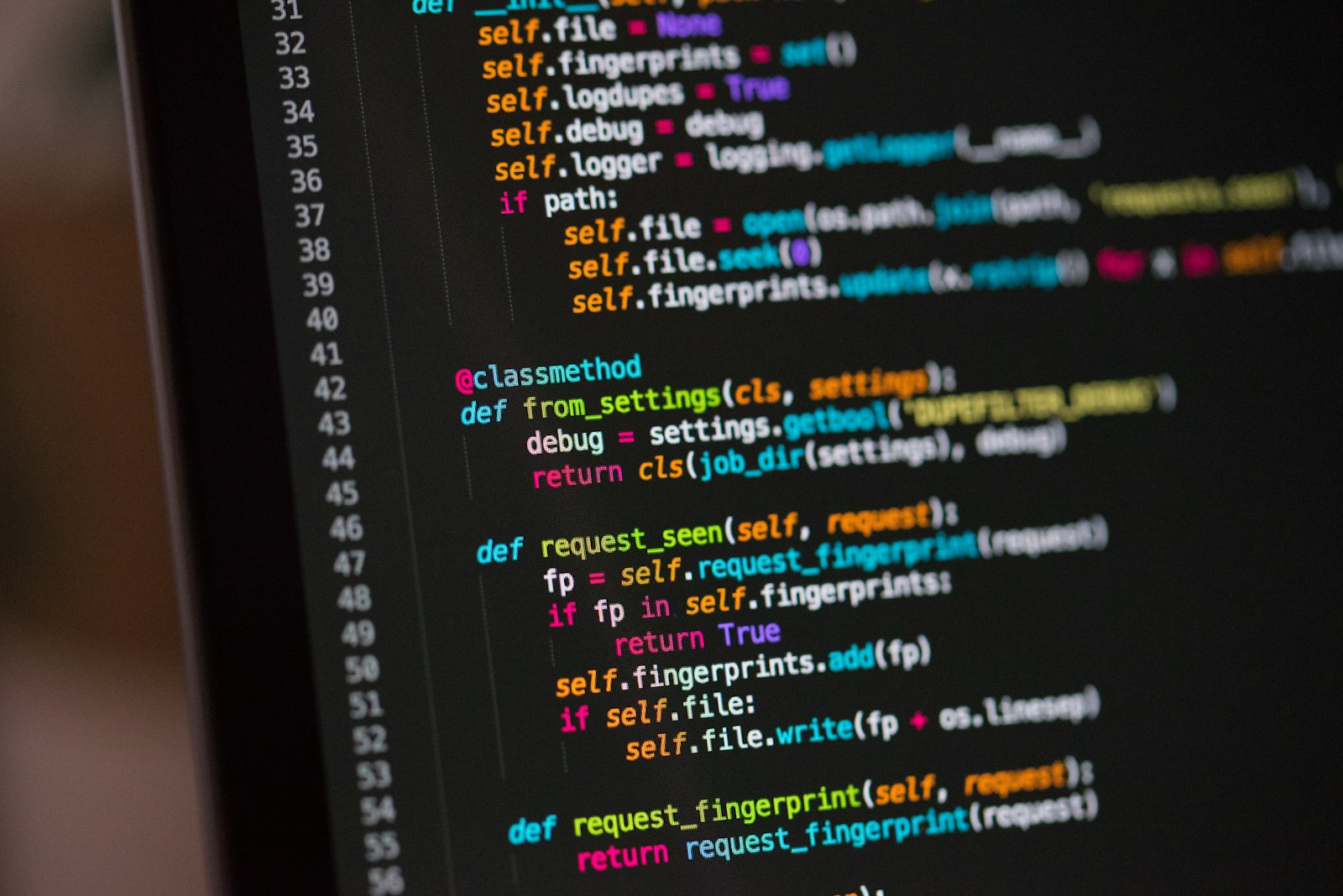 Close-up of syntax-highlighted source code on a monitor