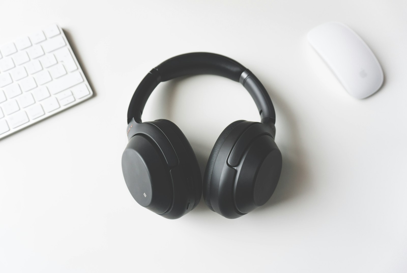 Black over-ear wireless headphones on a surface