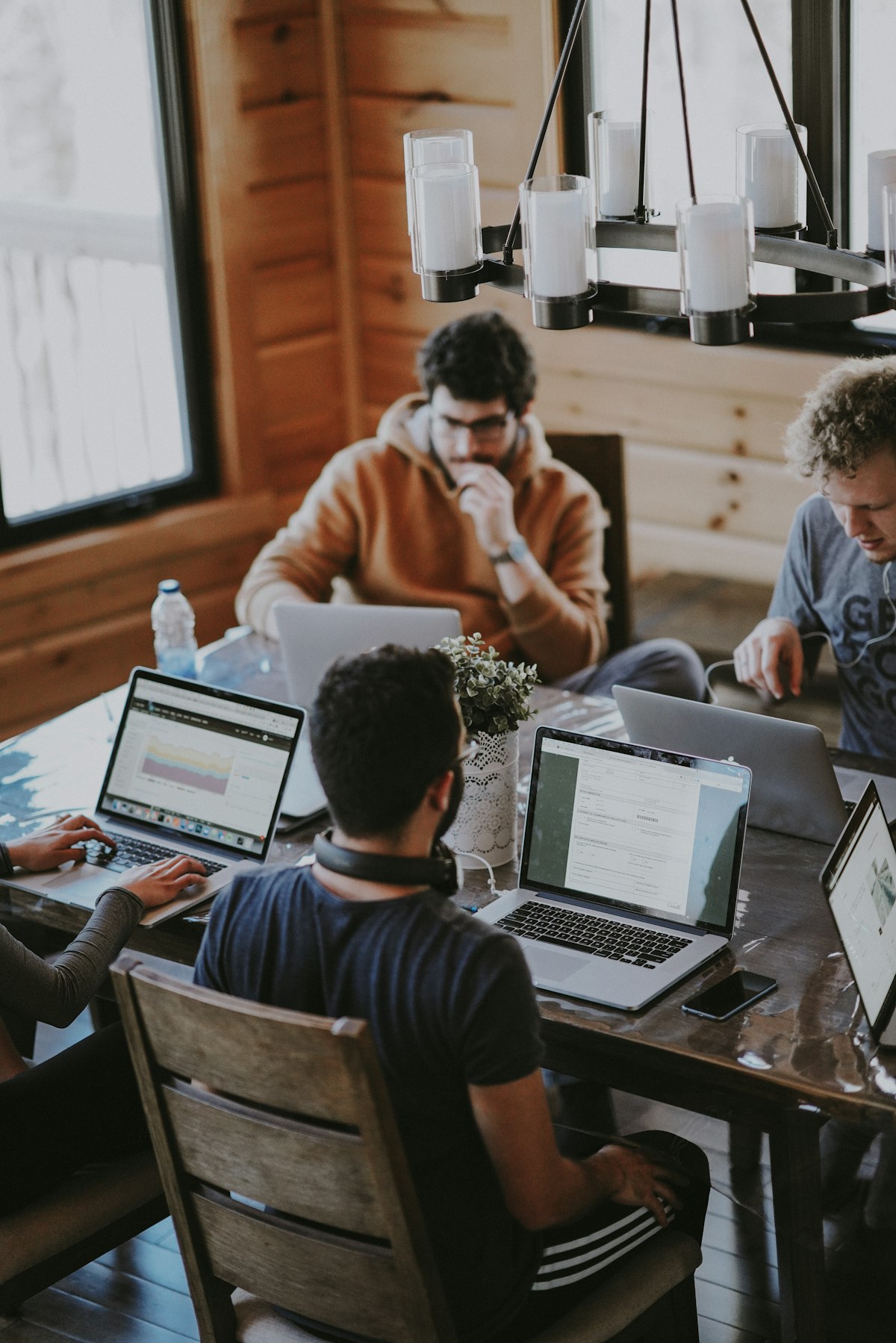 Business team discussing documents around a conference table