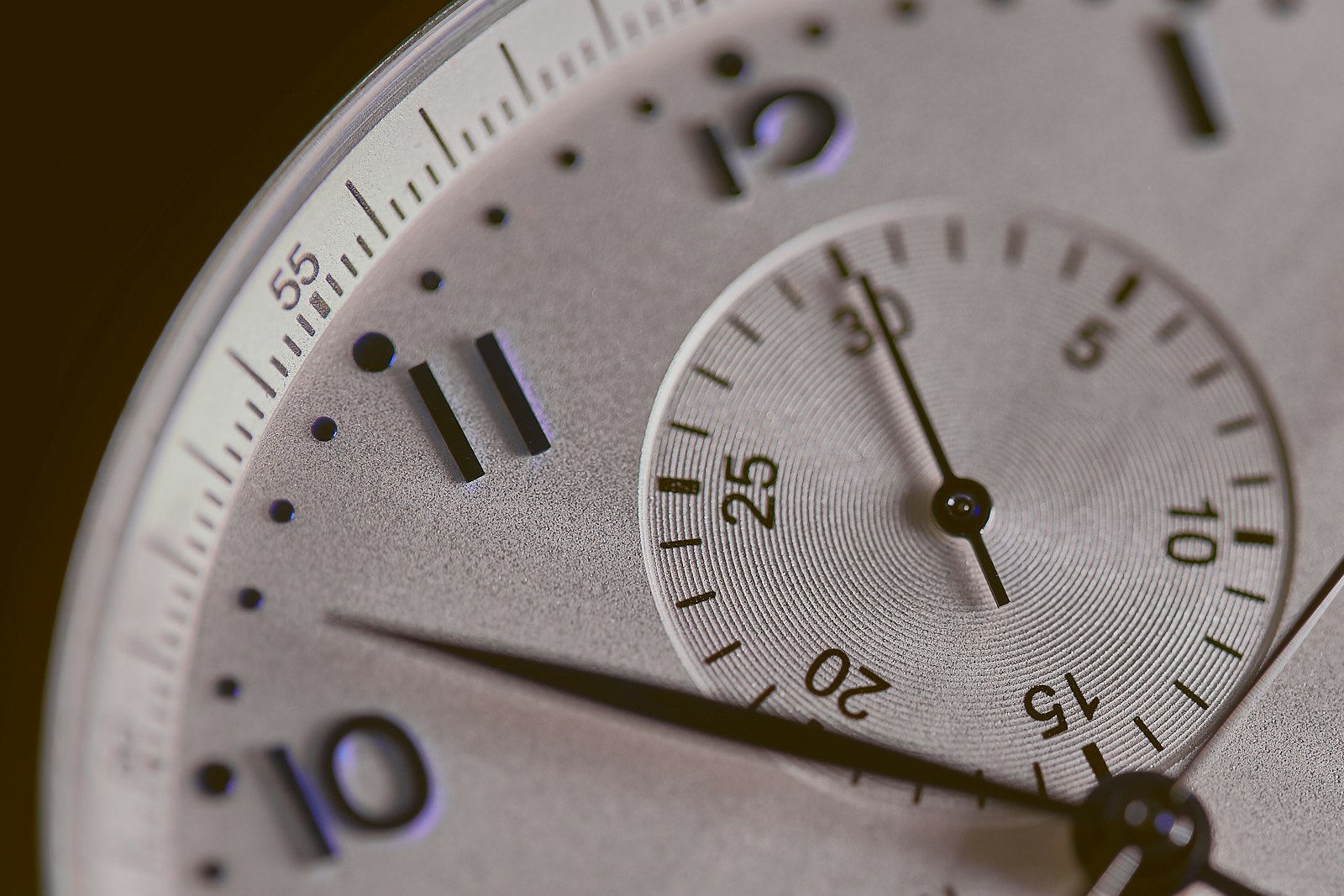 Close-up of a silver stopwatch face