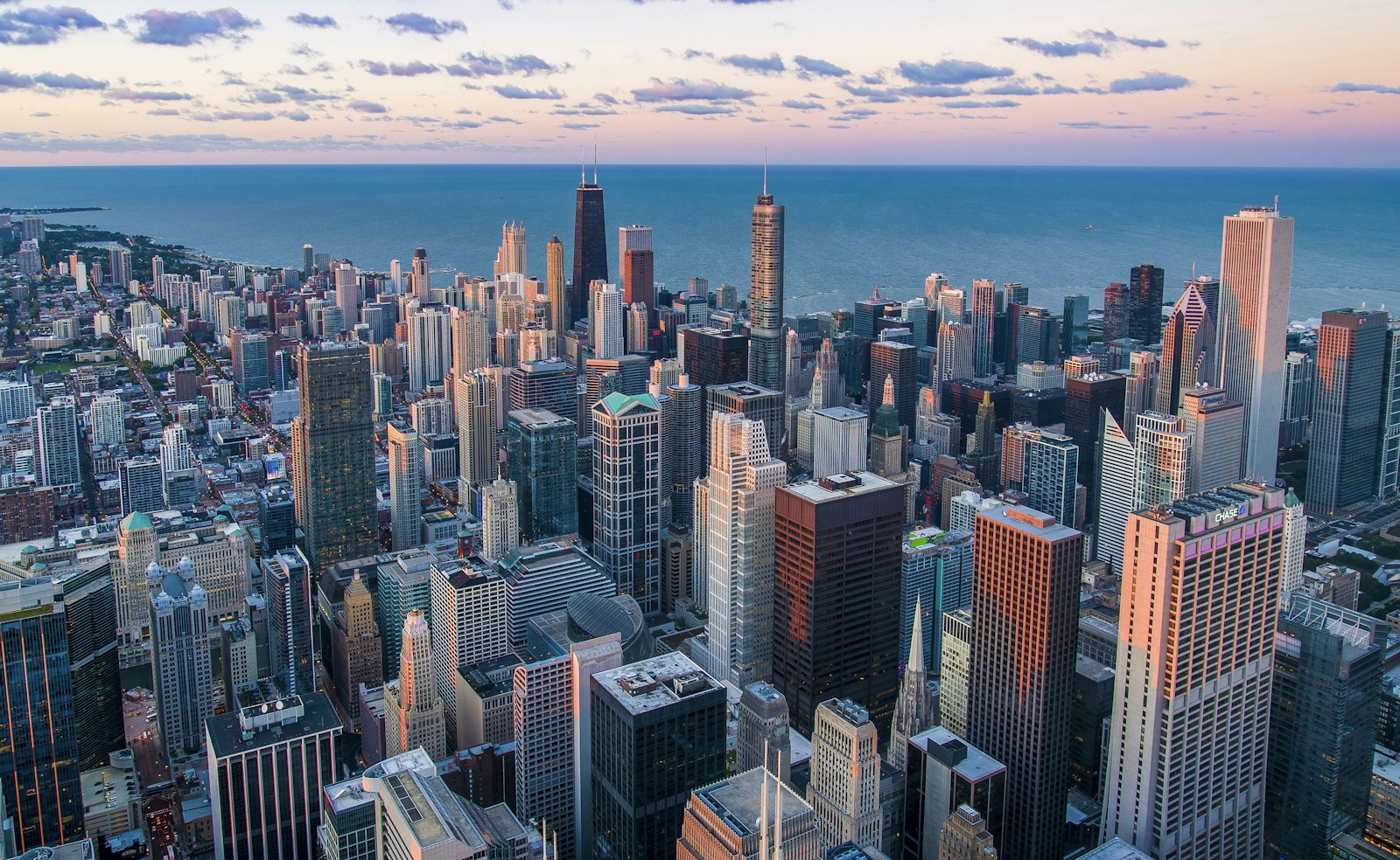 City skyline at dusk representing communities near major infrastructure