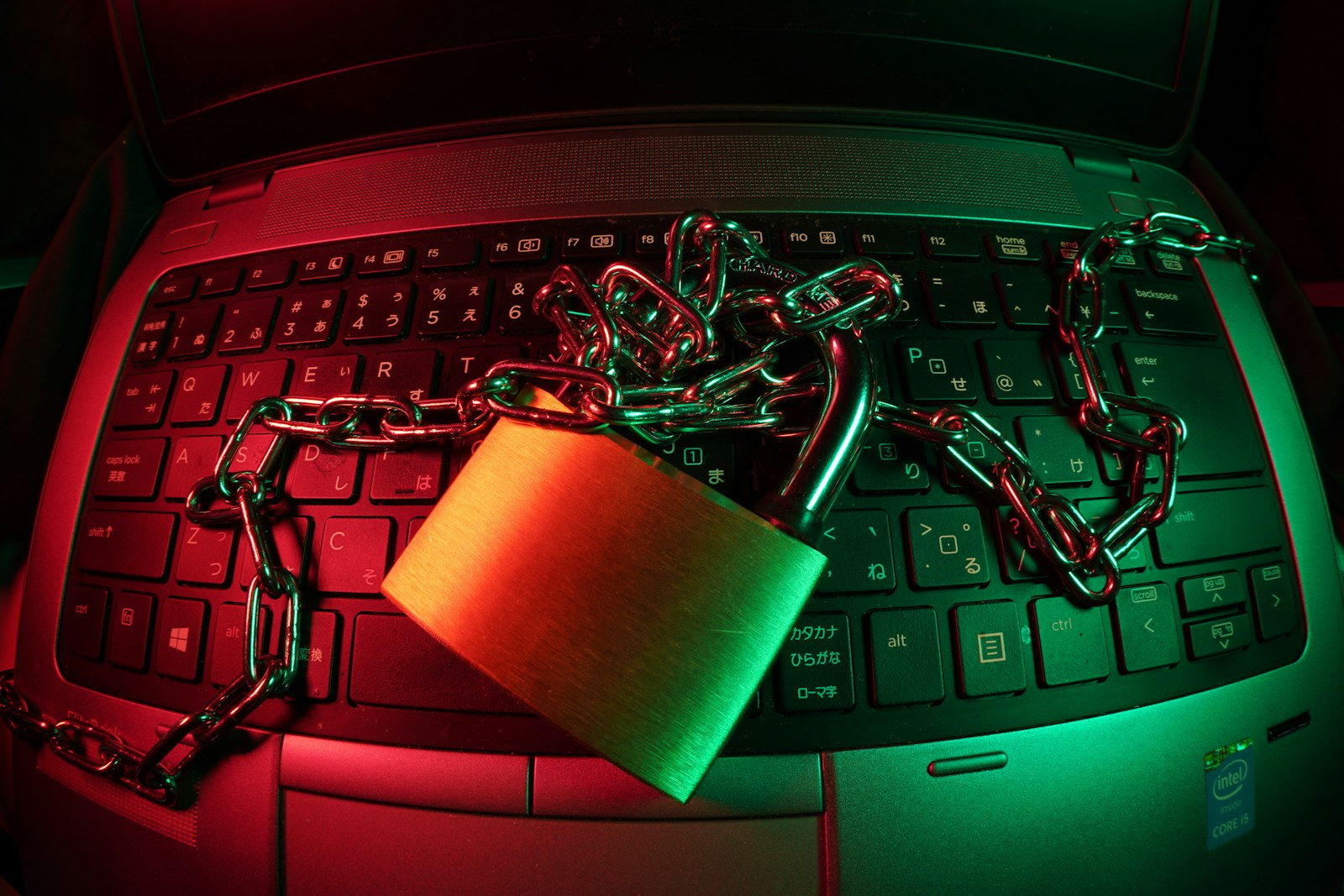 Padlock resting on a laptop keyboard as a privacy symbol