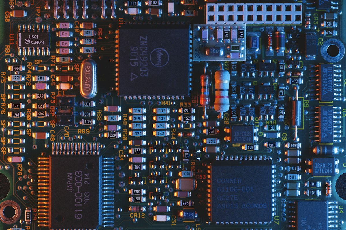 Blue circuit board close-up with electronic components