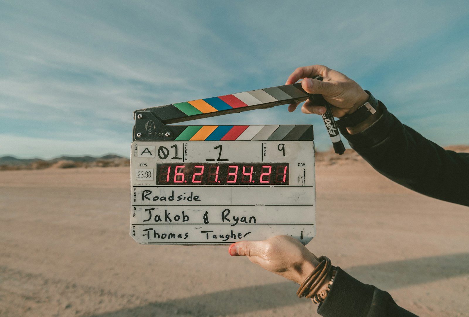 Film clapperboard held outdoors on a movie set