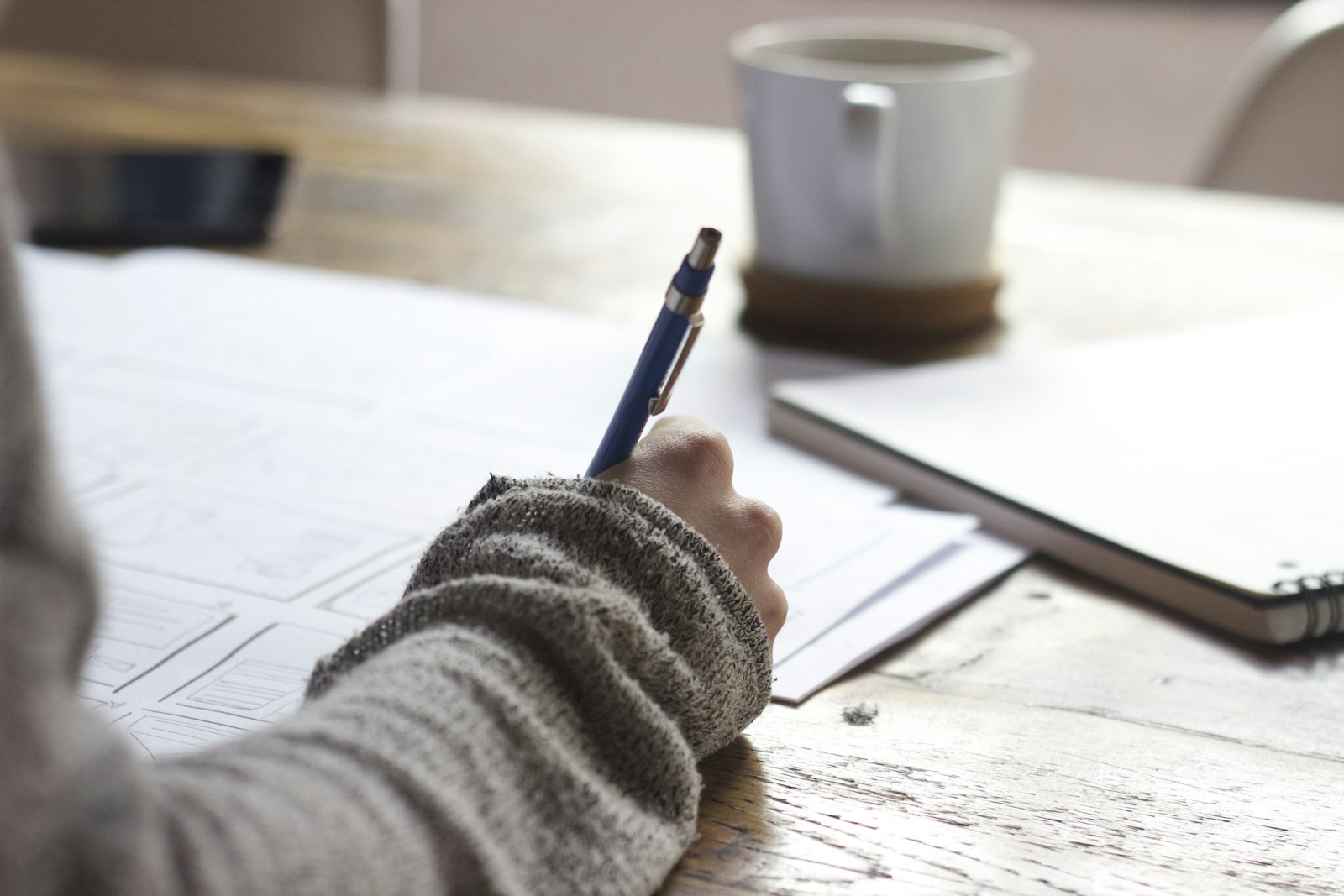 Open notebook and laptop on a desk for writing and planning