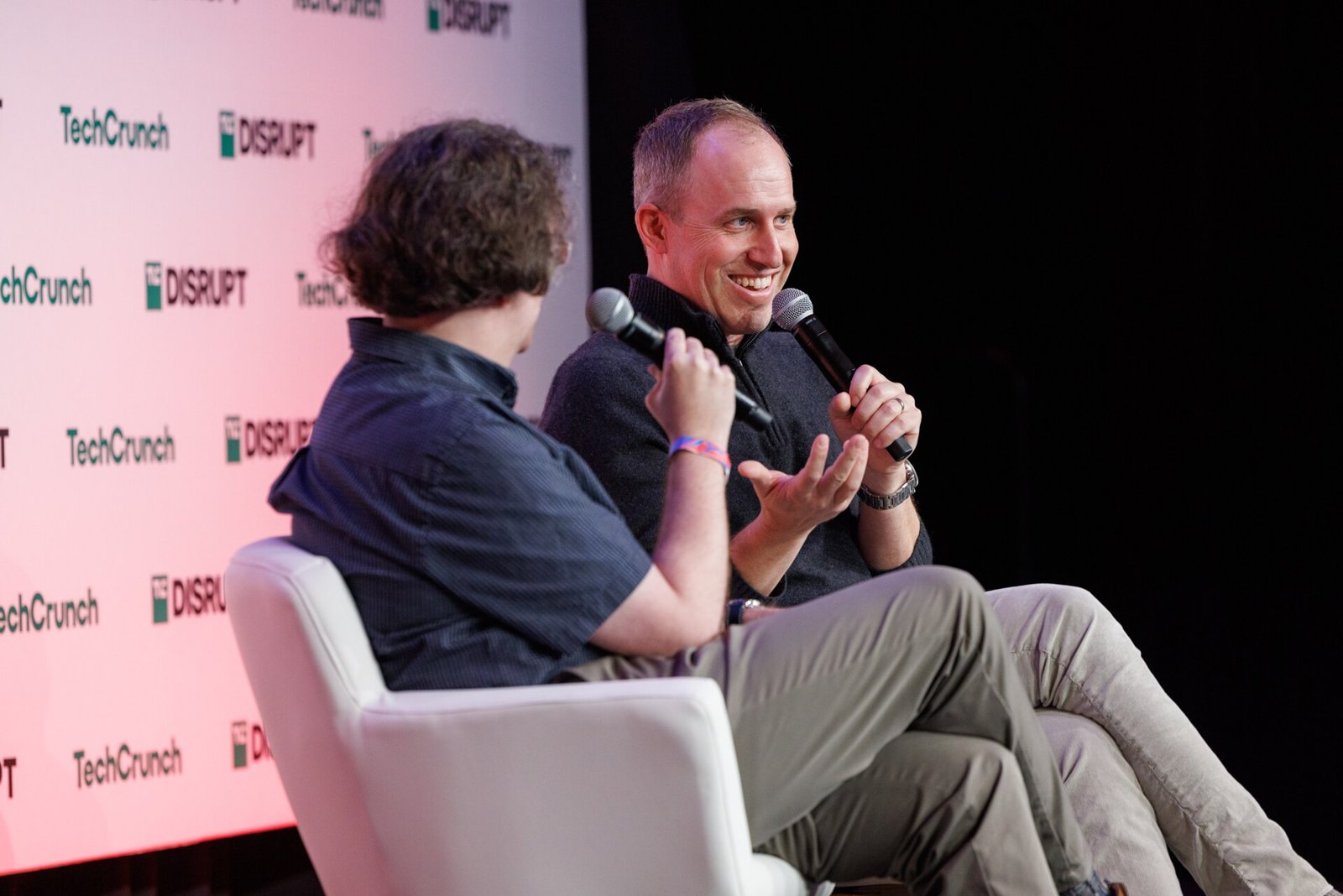 Bret Taylor speaks into a microphone during an onstage interview at TechCrunch Disrupt