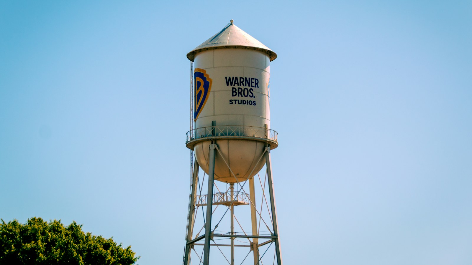 The Warner Bros. Studios water tower against a clear blue sky
